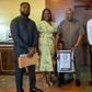 Young GWR holder Ace-Liam presents citation to John Dramani Mahama