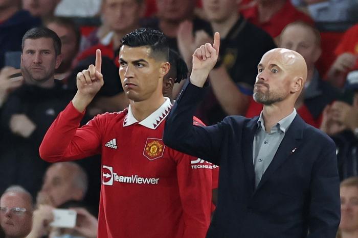 Soccer Football - Premier League - Manchester United v Liverpool - Old Trafford, Manchester, Britain - August 22, 2022 Manchester United's Cristiano Ronaldo with manager Erik ten Hag before coming on as a substitute REUTERS/Phil Noble