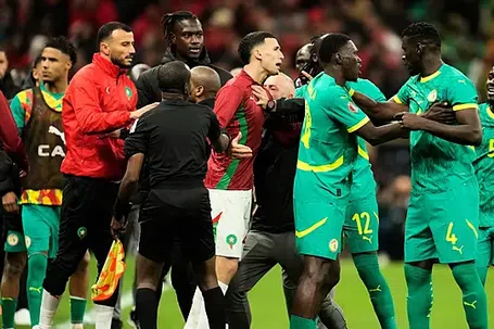 Senegal and Morocco players scuffle after a controversial penalty award in the Africa Cup of Nations final, © Copyright 2026 The Associated Press.