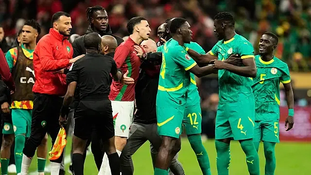 Senegal and Morocco players scuffle after a controversial penalty award in the Africa Cup of Nations final, © Copyright 2026 The Associated Press.