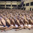 Inmates are lined up during a security operation at the Izalco prison in San Salvador, El Salvador, on April 25, 2020. El Salvador Presidency Press Office / AP