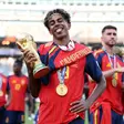 Lamine Yamal #19 of Spain celebrates with the FIFA World Cup Winner’s Trophy after the team’s victory following the FIFA World Cup 2026 Final match between Spain and Argentina (Photo by Alex Pantling - FIFA/FIFA via Getty Images) | FIFA via Getty Images