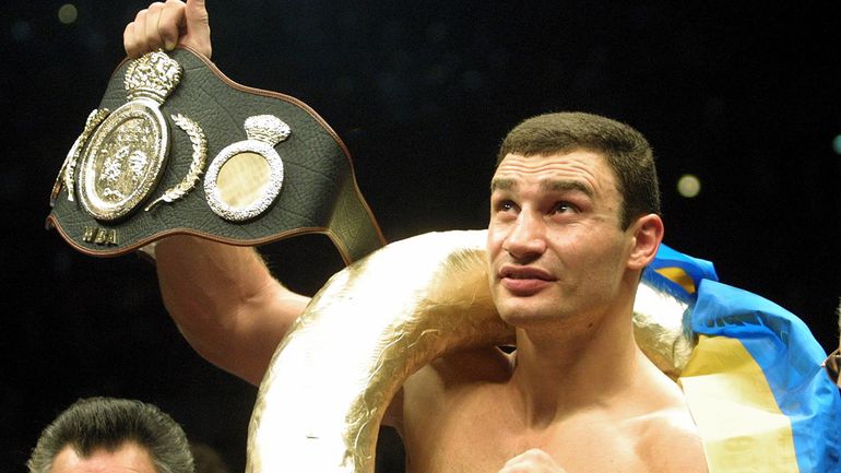 In this Jan. 28, 2001, file photo, Vitali Klitschko shows the world championship belt after he knocked out Orlin Norris in the first round of a WBO heavyweight title fight.
AP Photo/Camay Sungu, File