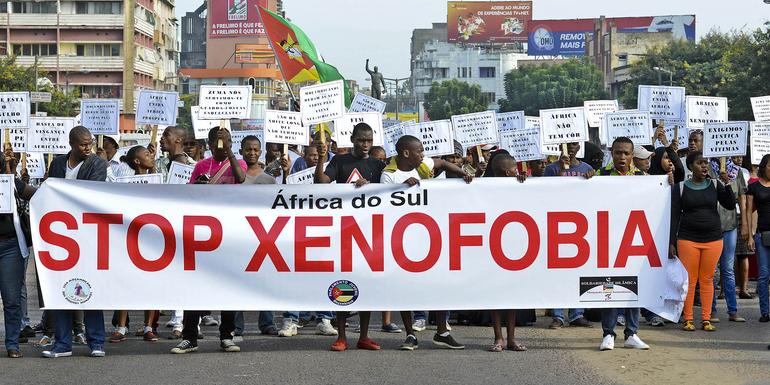 Hundreds of people n Maputo, Mozambique, march in protest against xenophobic attacks in South Africa. (Pntoibnio Silva)