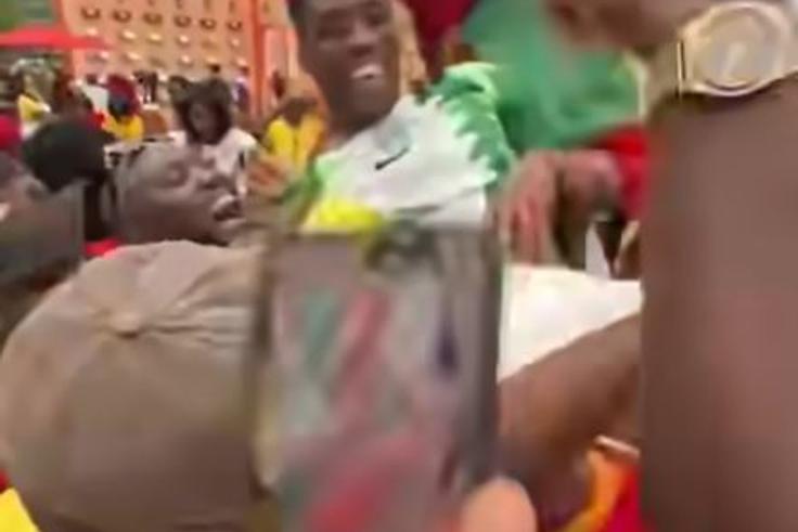 Ghanaians celebrate World Cup draw against England with a Nigerian in a joyful scene [Video]