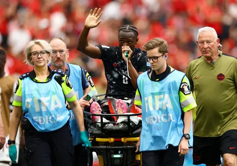 Canada’s Ismael Kone waves to the crowd as he uses a ‘green whistle’ (Penthrox), a portable, self-administered inhaler used by paramedics for fast-acting pain relief, after sustaining an injury and being stretchered off. [Agustin Marcarian/Reuters]