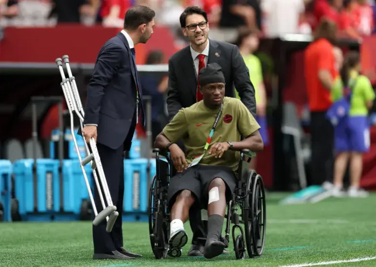 Ismael Kone #8 of Canada is seen on a wheelchair before the FIFA World Cup 2026 Group B match between Switzerland and Canada at BC Place Vancouver on June 24, 2026 in Vancouver, British Columbia. [Emilee Chinn/Getty Images/AFP]