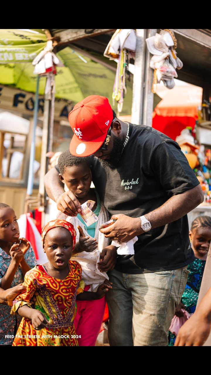 Merdalock feeds thousands on the street, donates cash gifts to families