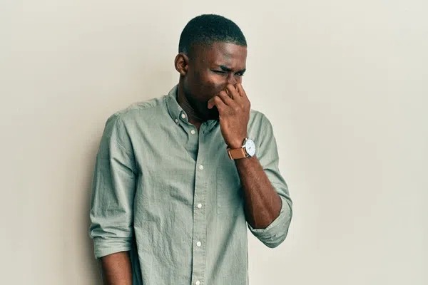 Persistent bad breath despite good hygiene is one of the symptoms of gum infection