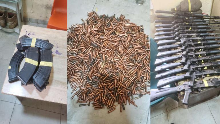Seized ammunition pile, AK-103 magazines, and assault rifles were recovered by DSS operatives during the highway raid.