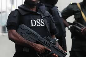 Department of State Services DSS operative holding tactical weapon during security operation in Nigeria.