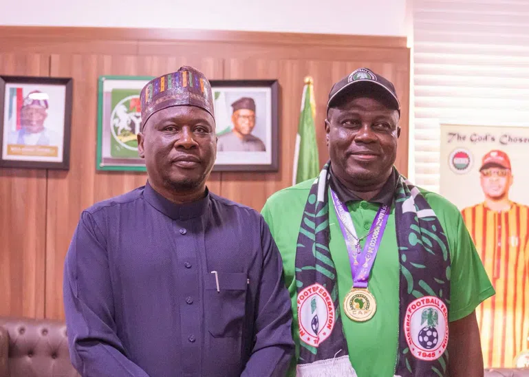 Adamawa State Governor, Ahmadu Fintiri and the coach of the Super Falcons, Justine Madugu.
