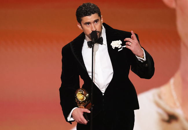 Bad Bunny holding the Grammy while making his speech