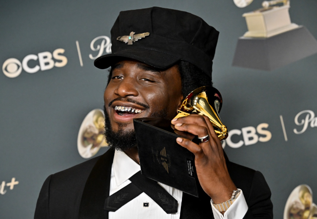Shaboozey holds his first Grammy award