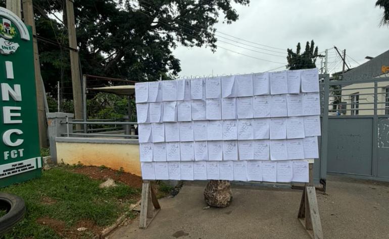 Candidate particulars and affidavits posted on a display board outside the INEC FCT office in Abuja for public inspection.