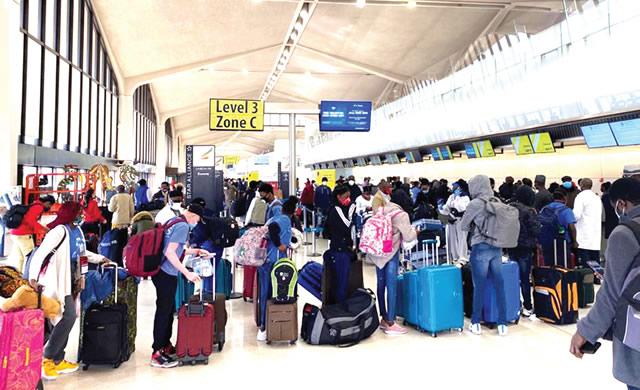 Travellers at an international airport amid discussions around US deportation