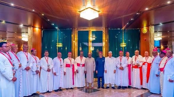 President Bola Ahmed Tinubu poses with a delegation from the Catholic Bishops' Conference of Nigeria (CBCN) during a meeting at the State House in Abuja.