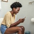 So, You Love Scrolling on the Toilet? Here’s What It’s Doing to Your Body