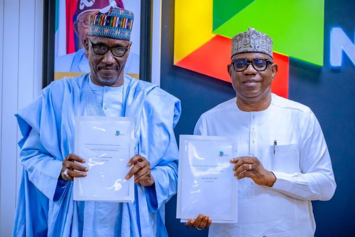 The new Group Chief Executive Officer of the Nigerian National Petroleum Company Limited (NNPC Ltd.), Bayo Ojulari (right) officially takes over from his predecessor, Mr Mele Kyari (left).