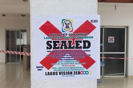 Official Lagos State Safety Commission "Sealed" notice posted on a building in Lekki following elevator safety violations.
