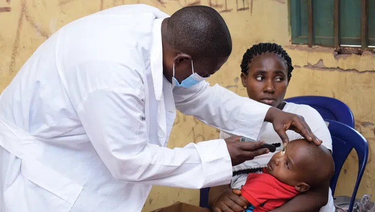 Doctor attending to patient amid staffing shortages