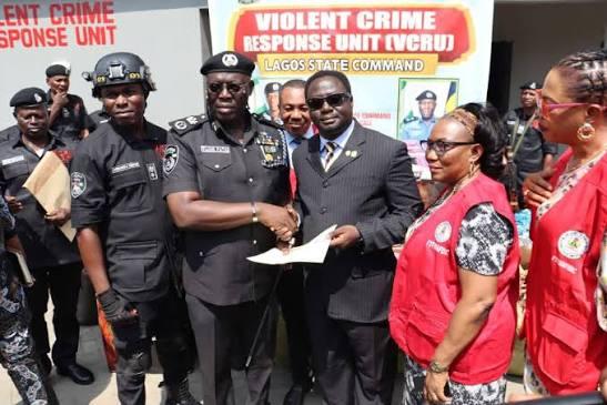 Lagos State Commissioner of Police, Fatai Tijani, hands over case files and seized counterfeit drugs to NAFDAC officials at the Violent Crime Response Unit (VCRU).