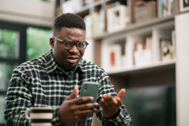 Nigerian man confused by why his mobile data finished so fast while using his phone.