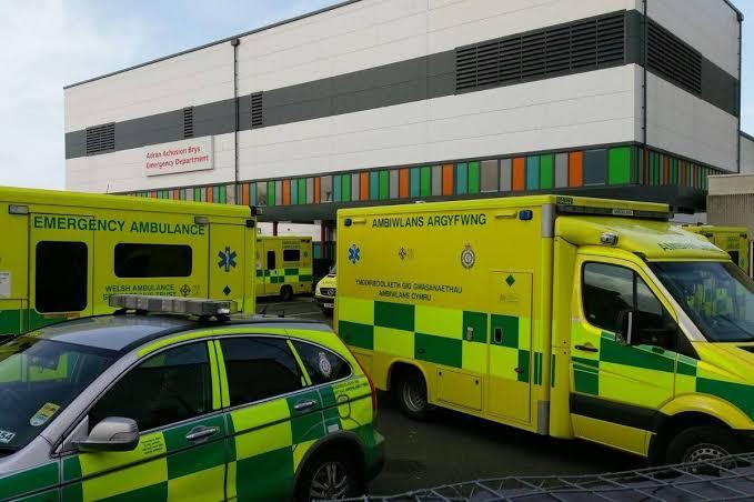 Emergency services vehicles at the entrance of Ysbyty Glan Clwyd Hospital's Accident and Emergency department.