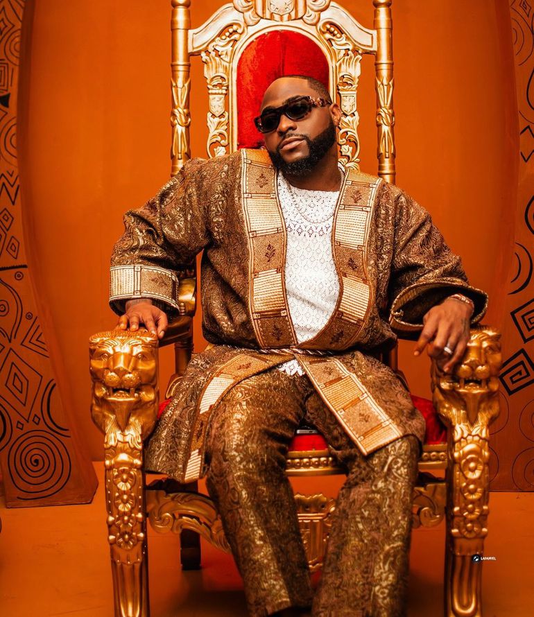 Davido sitting on a gold lion-carved throne, representing his dominance in the Afrobeats industry before his political hiatus.