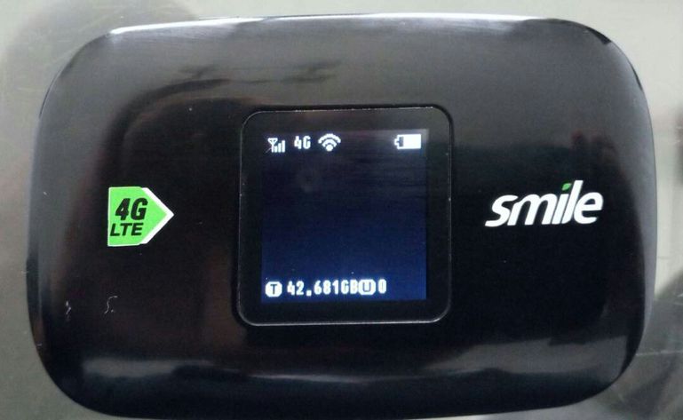A black Smile 4G LTE SMiFi mobile hotspot device showing a 42GB data balance on the small digital screen.