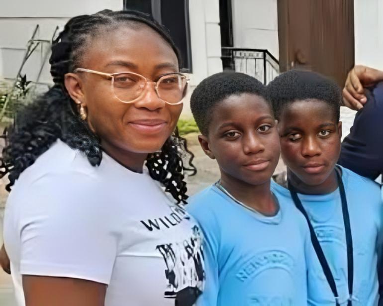 Mrs. Olaide Busayo Adegoke John-Paul smiling beside her 12-year-old twin sons, Peter and Paul, after being rescued by the Oyo State police.