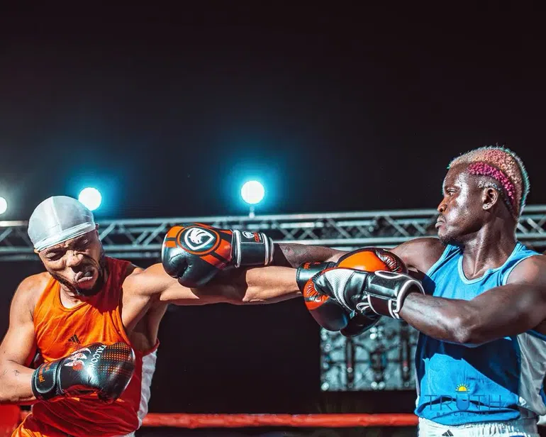 Nigerian singers Portable and Charles Okocha in the ring during their boxing match.