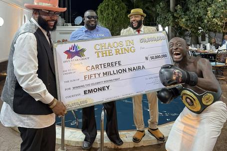 Carter Efe receives 50 million Naira cheque from E-Money after defeating Portable in Chaos in the Ring 4.
