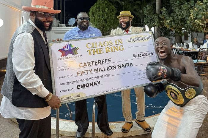 Carter Efe receives 50 million Naira cheque from E-Money after defeating Portable in Chaos in the Ring 4.