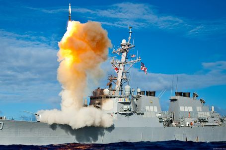 An Arleigh Burke-class guided-missile destroyer, like the USS Mason, launching a vertical interceptor missile from its deck during a naval engagement.