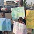 'I'm scared of going to school' Mother, three children stage protest in Abuja, demand rescue of abducted pupils