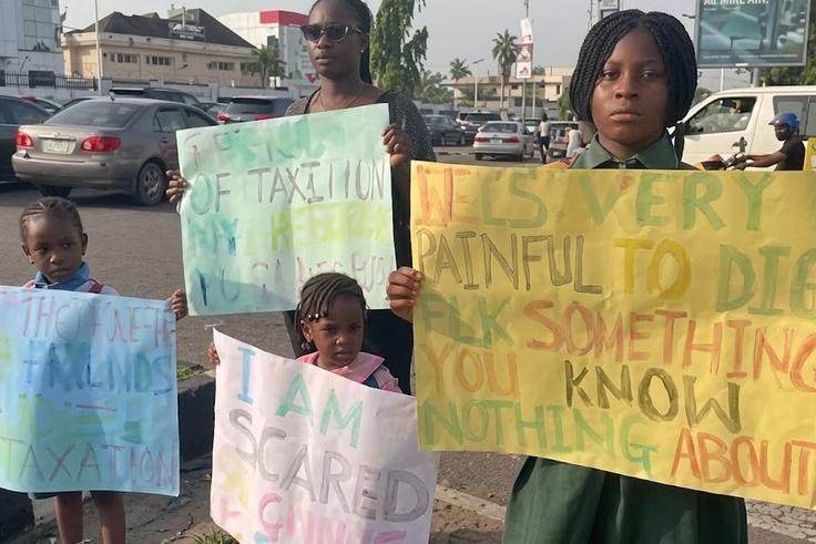 'I'm scared of going to school' Mother, three children stage protest in Abuja, demand rescue of abducted pupils