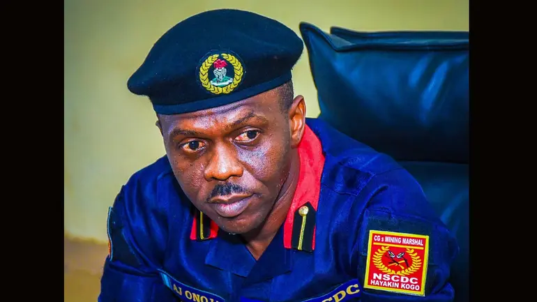 Close-up of Commander Attah John Onoja in his dark blue Nigeria Security and Civil Defence Corps Mining Marshal uniform.