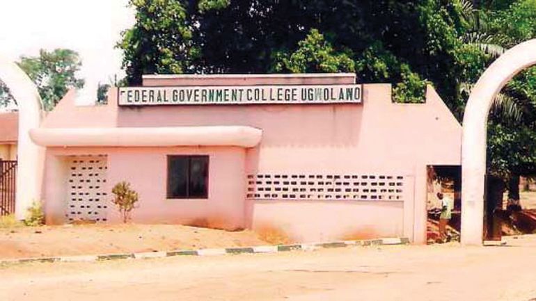 The pink-painted entrance gate of Federal Government College Ugwolawo
