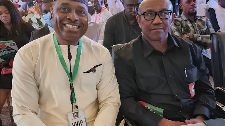 Kenneth Okonkwo and Peter Obi sitting next to each other at a political event as campaign allies.