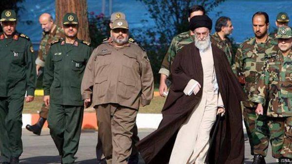 Iranian Supreme Leader Ali Khamenei walking alongside military commanders and generals of the Islamic Revolutionary Guard Corps.