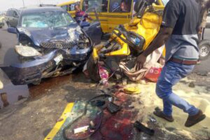The relics of the Toyota Matrix car and Bajaj Tricycle that collided along the Lagos-Badagry Expressway on Saturday