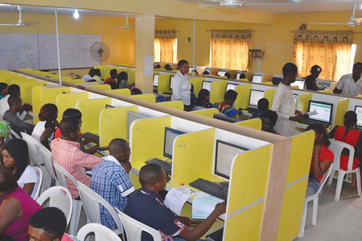 Candidates working on desktop computers during a previous UTME session.