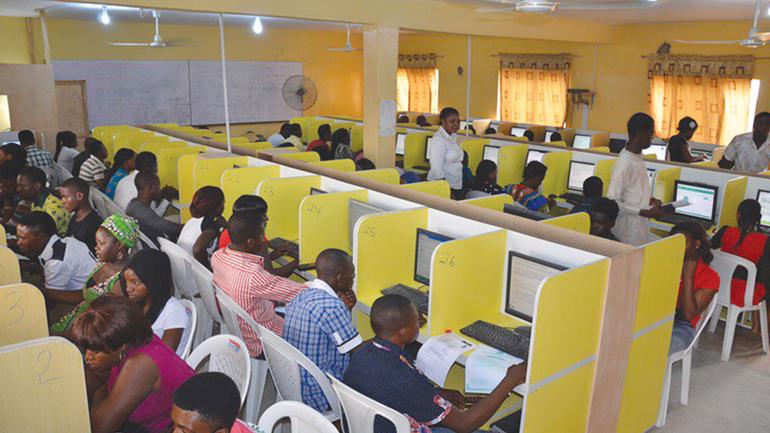 Candidates working on desktop computers during a previous UTME session.