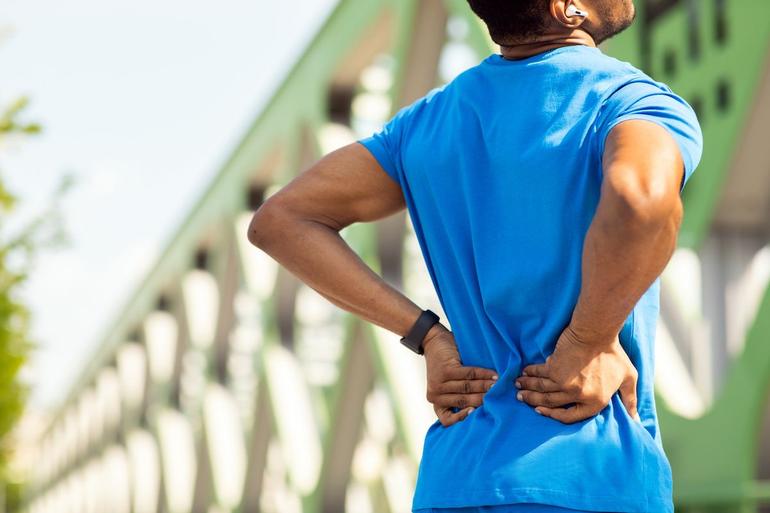 Persistent lower back pain is a common warning sign that should be checked by a medical professional.