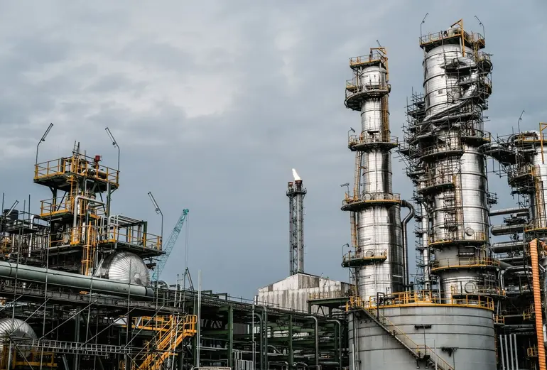 Exterior view of the Dangote Petroleum Refinery industrial towers and processing units in Lekki, Lagos.