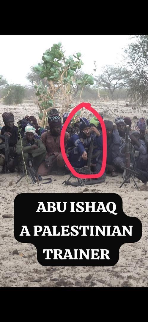 Abu Ishaq a Palestinian trainer circled in red holding a gun with ISWAP insurgents.