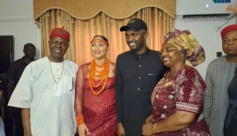 Chief Ezeokafor Snr. (left) and family members, including his son, the socialite Jowizaza (center), during a private celebration.