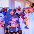 Governor Abba Yusuf (centre) says the state government will take full responsibility for the welfare, education, and overall development of the twins.