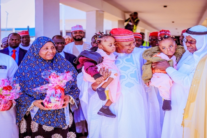Governor Abba Yusuf (centre) says the state government will take full responsibility for the welfare, education, and overall development of the twins.